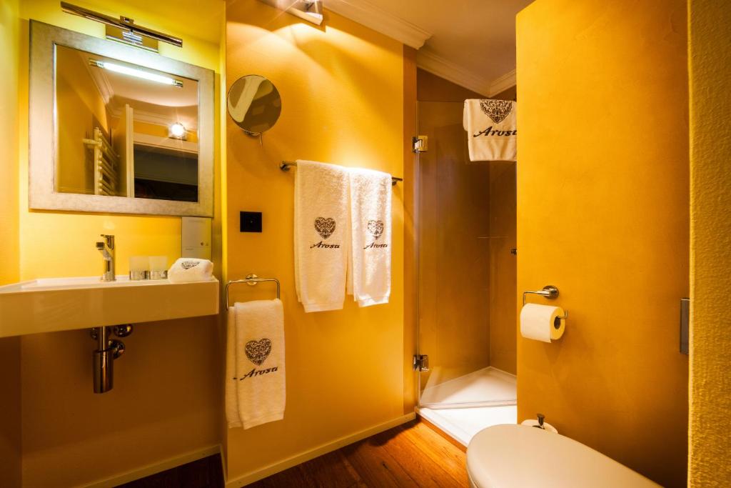 Koupelna v ubytování Home Hotel Arosa