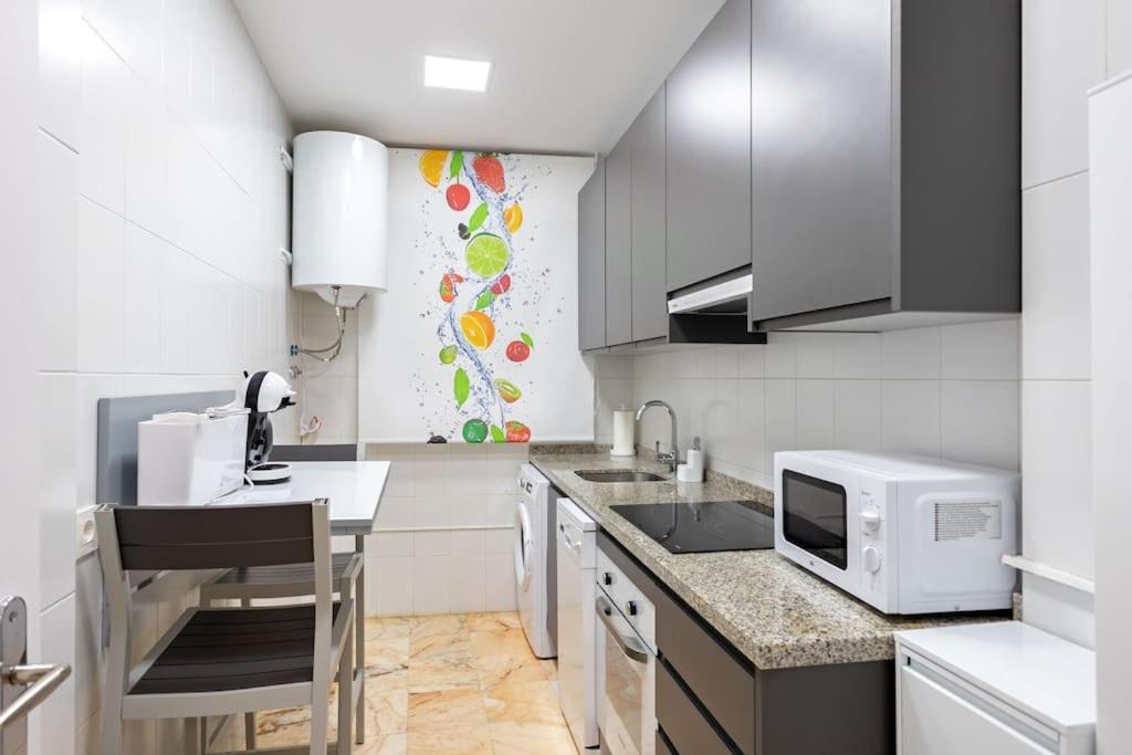 A kitchen or kitchenette at Jimios city center by Valcambre