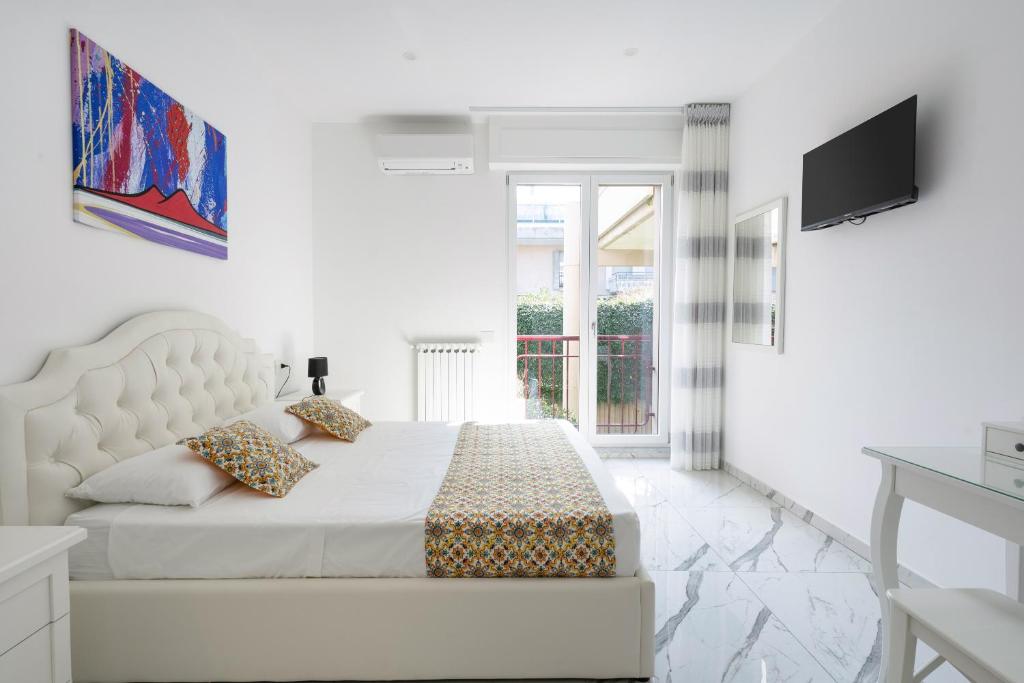 TV a/nebo společenská místnost v ubytování Deluxe Suites