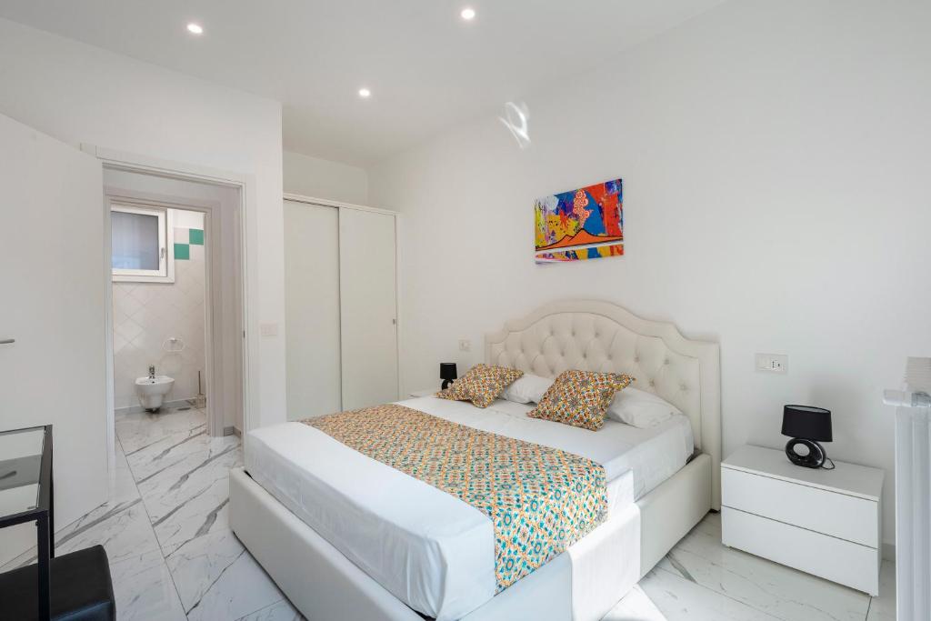 Postel nebo postele na pokoji v ubytování Deluxe Suites