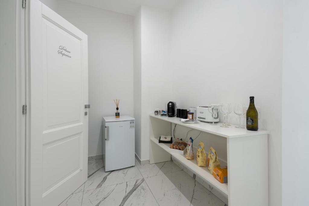 Kuchyň nebo kuchyňský kout v ubytování Deluxe Suites
