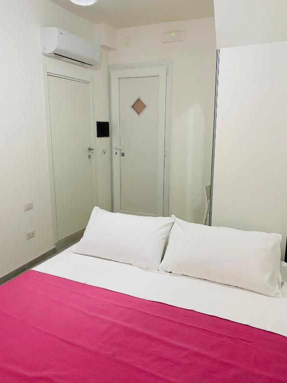 Postel nebo postele na pokoji v ubytování Casa 68 Ortigia