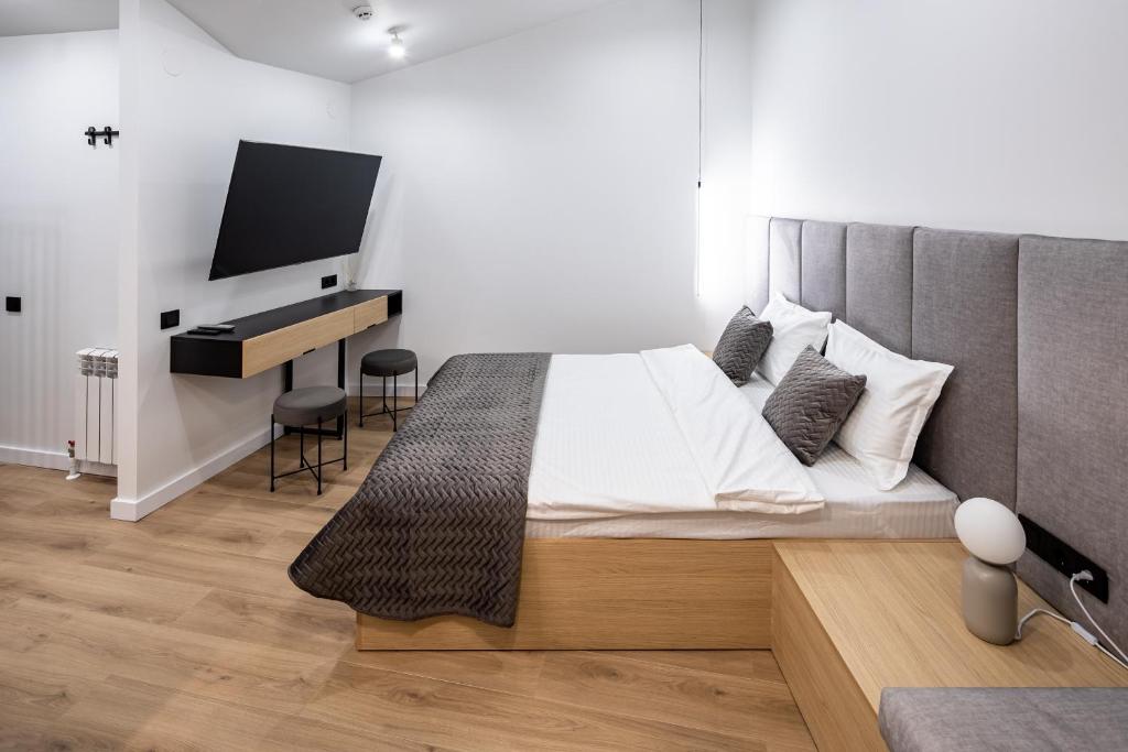 Postel nebo postele na pokoji v ubytování MONTENEL Apartel