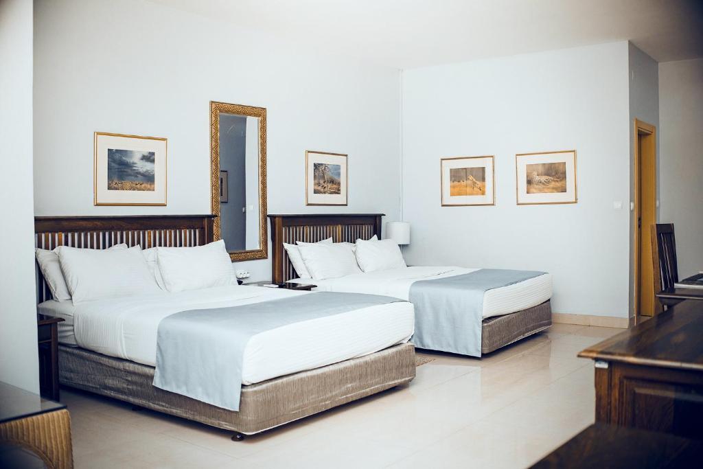 Voodi või voodid majutusasutuse Hotel Terminus Maputo toas