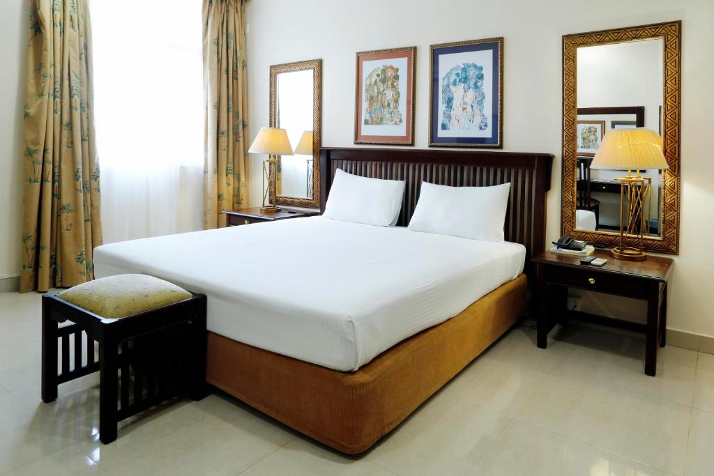 Voodi või voodid majutusasutuse Hotel Terminus Maputo toas