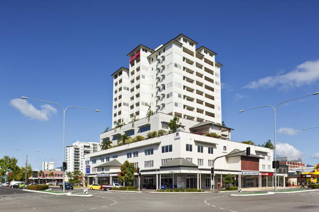 a large building with a large clock on the side of it at Cairns Central Plaza Apartment Hotel in Cairns