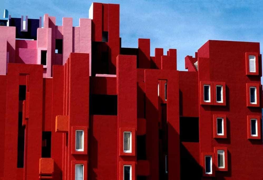 a red building with lots of tall buildings at Apartamento único en Muralla Roja - 0412 in Calpe