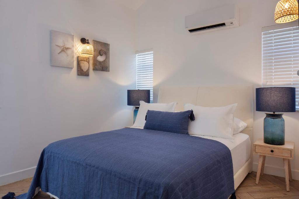 A bed or beds in a room at Ada Dreams City