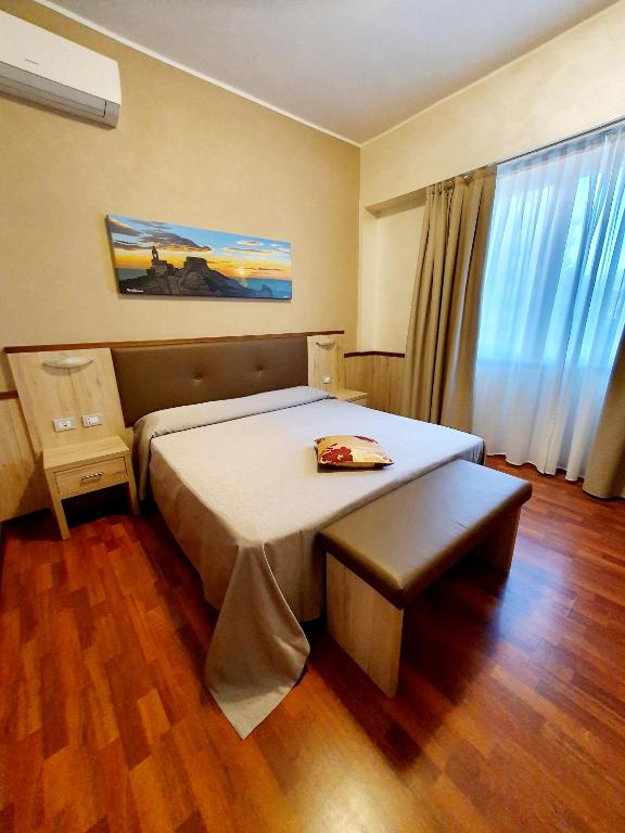 Postel nebo postele na pokoji v ubytování Hotel Corallo