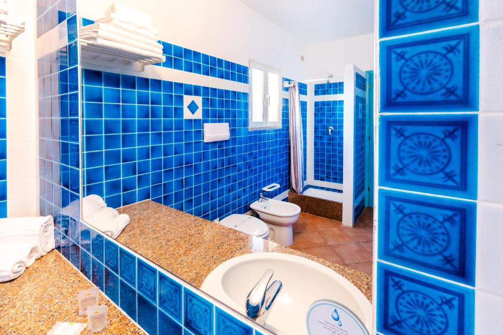 Koupelna v ubytování Residence Hotel Lu Nibareddu