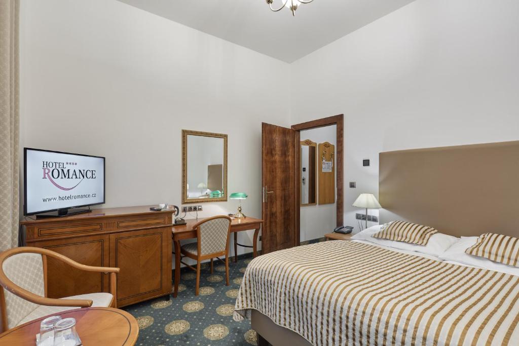 Voodi või voodid majutusasutuse Hotel Romance toas
