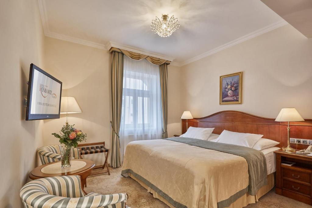 Voodi või voodid majutusasutuse Hotel Romance toas