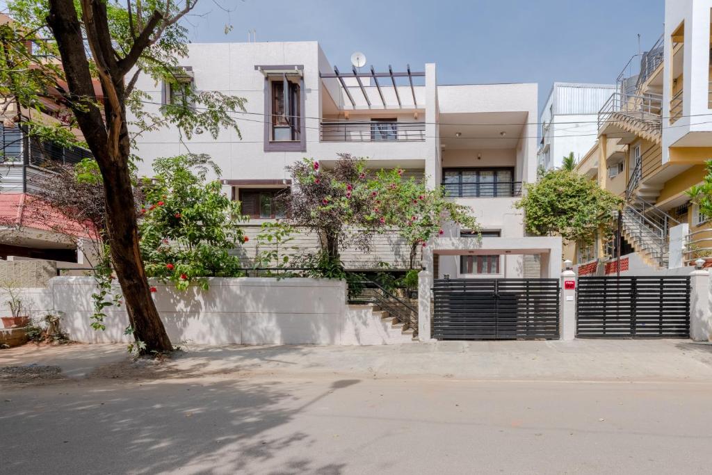 an empty street in front of a building at Villa 9C by Revkeys in Bangalore