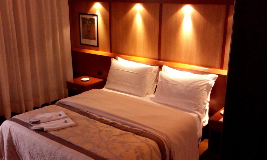 Postel nebo postele na pokoji v ubytování Hotel Motel Ovest