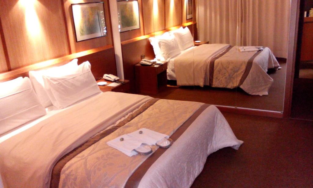 Postel nebo postele na pokoji v ubytování Hotel Motel Ovest