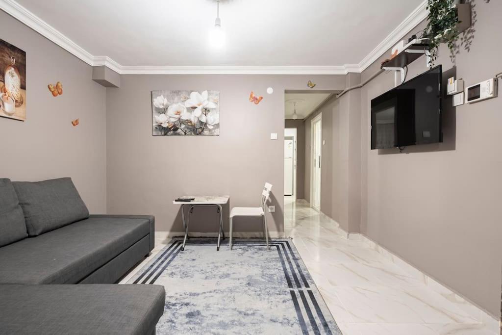 a living room with a couch and a table at Central Istanbul Apartments in Istanbul