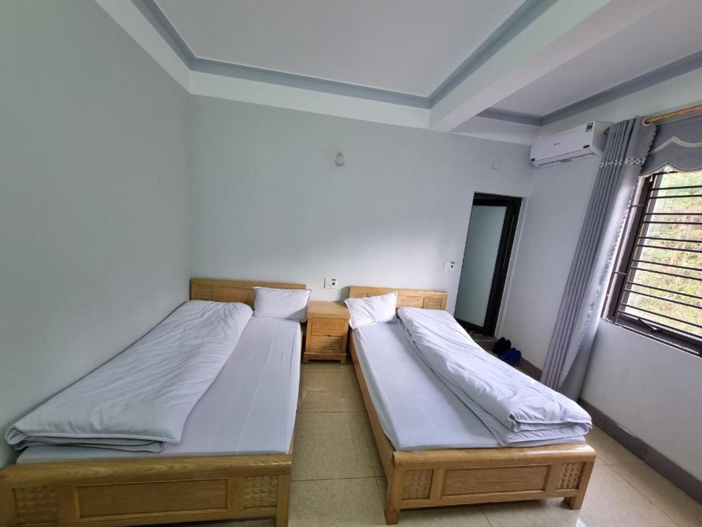 Postel nebo postele na pokoji v ubytování NHÀ NGHỈ T&T