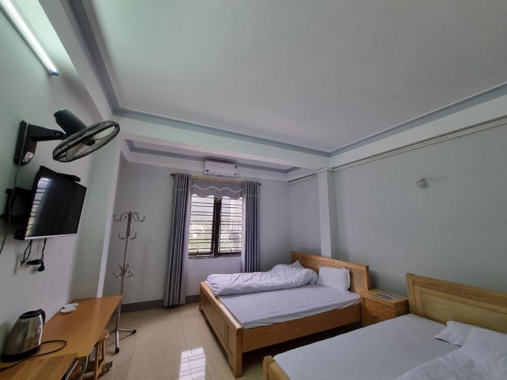 Postel nebo postele na pokoji v ubytování NHÀ NGHỈ T&T