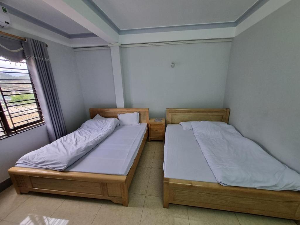 Postel nebo postele na pokoji v ubytování NHÀ NGHỈ T&T