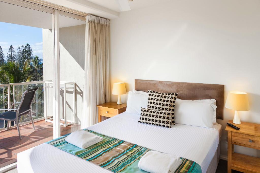 Letto o letti in una camera di Sandcastles Mooloolaba