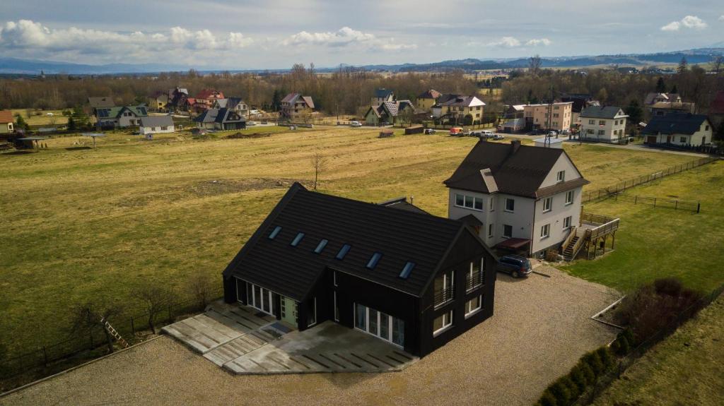 an aerial view of a house in a field at PO PTOKACH in Czarny Dunajec