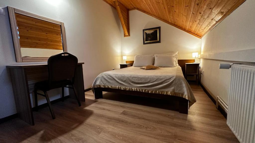 Postel nebo postele na pokoji v ubytování Club Satelit Zlatibor