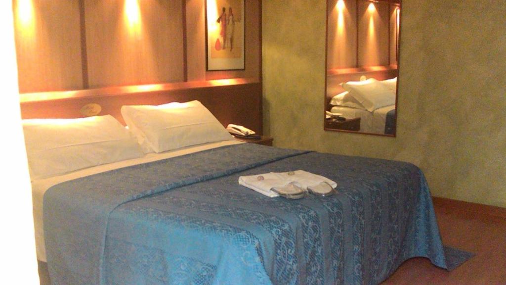 Postel nebo postele na pokoji v ubytování Hotel Motel Ovest