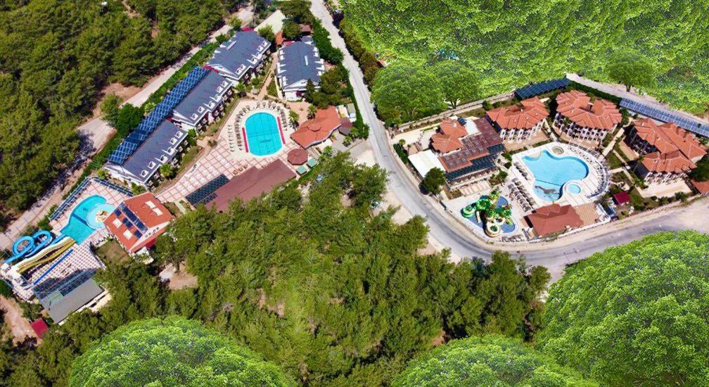 an aerial view of a resort with two swimming pools at Telmessos Neva Hotel - Halal-Non Alcoholic All Inclusive-Muhafazakar Hotel in Oludeniz