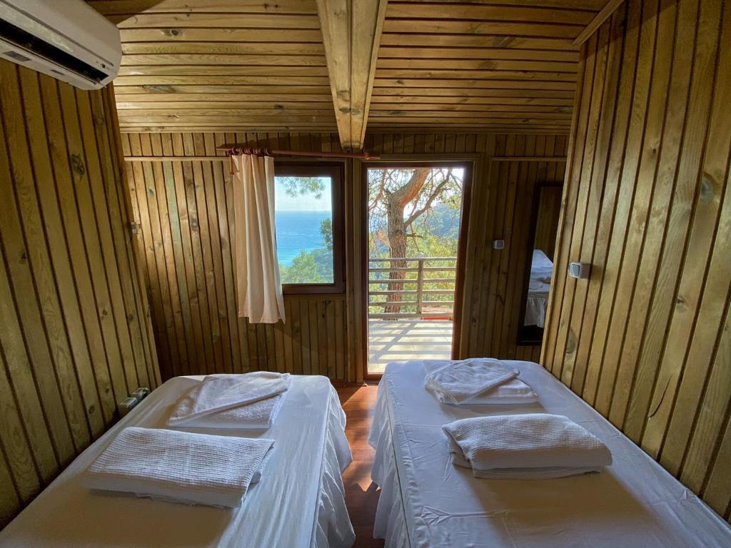 Кровать или кровати в номере Tree Houses Hotel