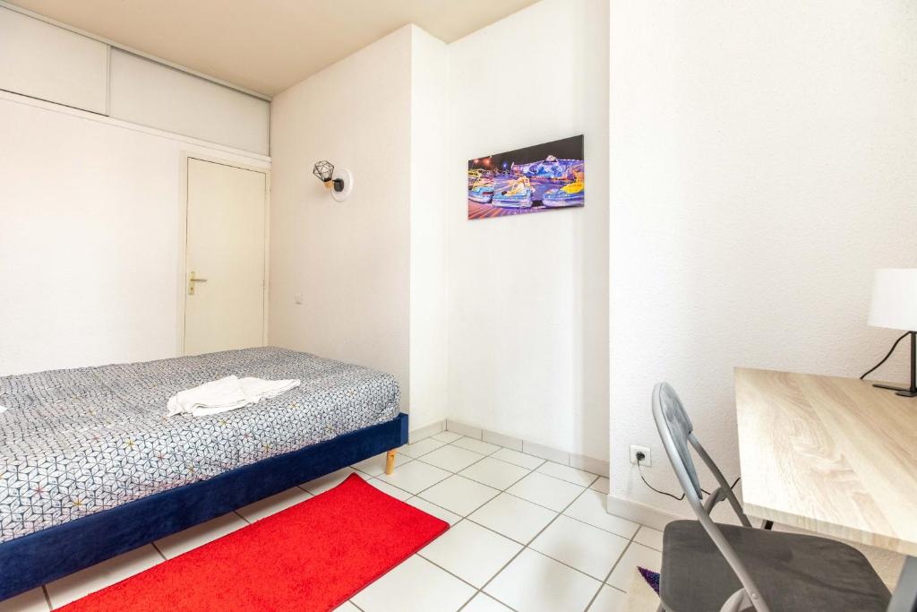 Posteľ alebo postele v izbe v ubytovaní Appartement spacieux Luna Park centre
