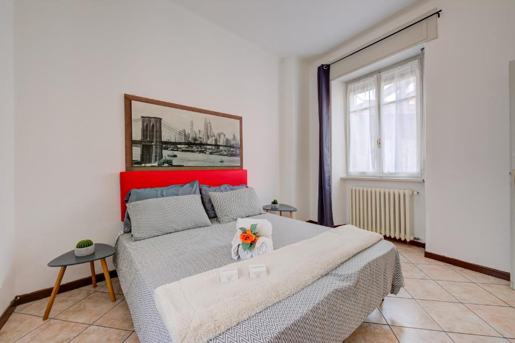 A bed or beds in a room at Casa Rachele Stresa Center - Happy Rentals