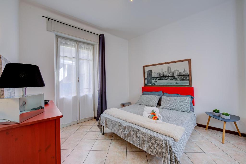 A bed or beds in a room at Casa Rachele Stresa Center - Happy Rentals