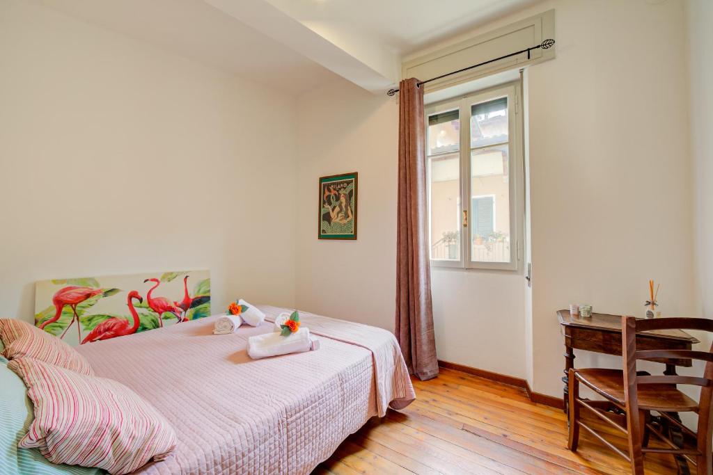 A bed or beds in a room at Casa Rachele Stresa Center - Happy Rentals