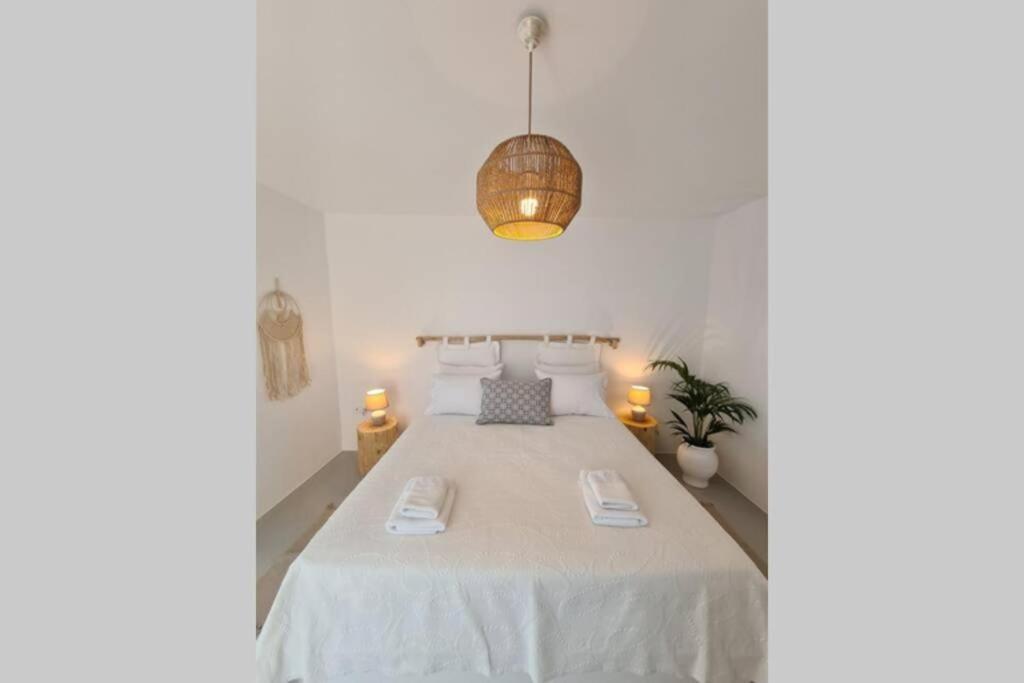 Postel nebo postele na pokoji v ubytování Kaiya Villas
