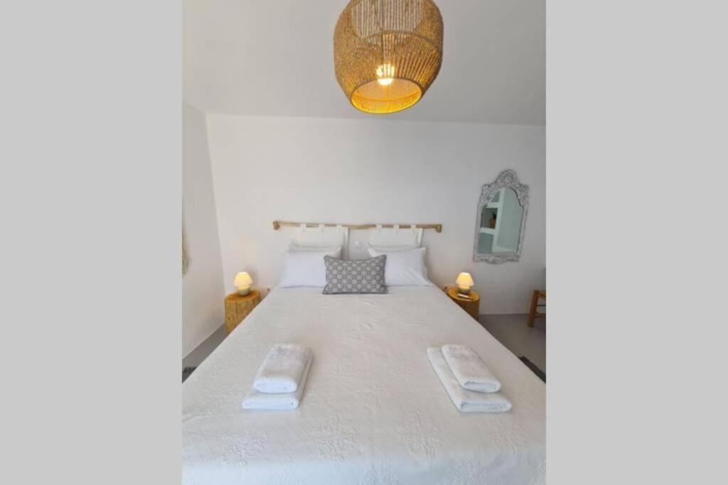 Postel nebo postele na pokoji v ubytování Kaiya Villas