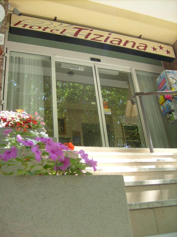 a store front with flowers in front of it at Hotel Tiziana in Rimini
