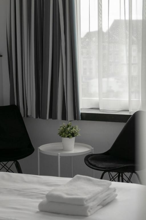Postel nebo postele na pokoji v ubytování Hotel de la Bourse