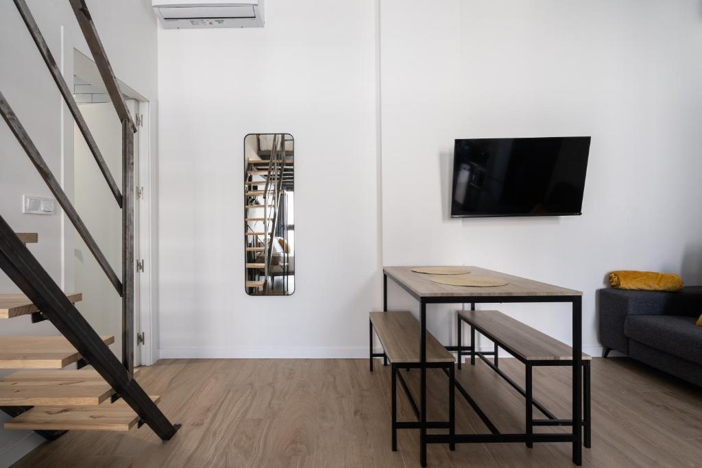 Televízia a/alebo spoločenská miestnosť v ubytovaní Vip Apartments Valencia
