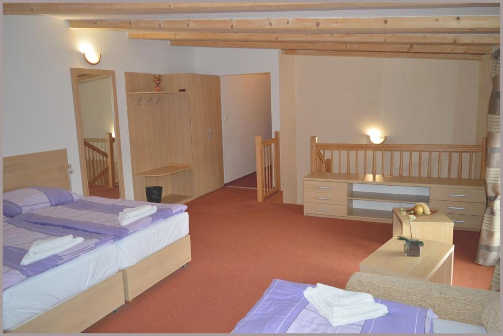 Postel nebo postele na pokoji v ubytování Apartmány Tiva