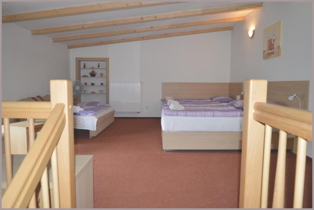 Postel nebo postele na pokoji v ubytování Apartmány Tiva