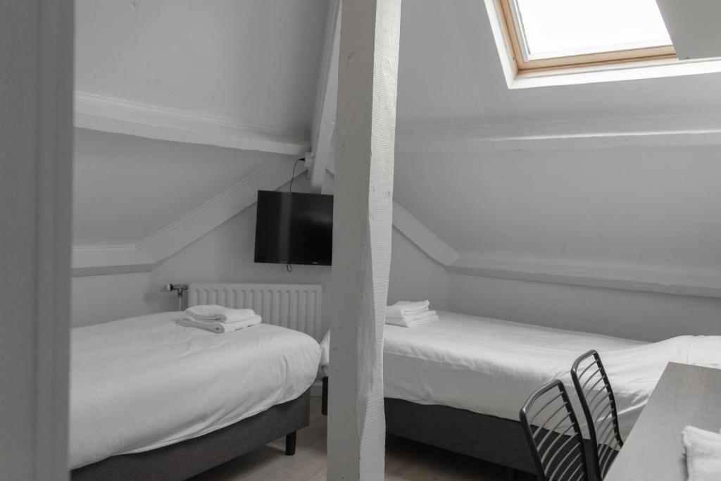 Postel nebo postele na pokoji v ubytování Hotel de la Bourse