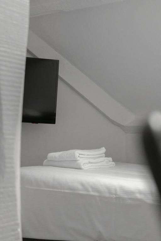 Postel nebo postele na pokoji v ubytování Hotel de la Bourse