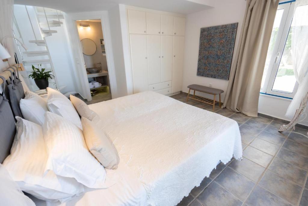 Postel nebo postele na pokoji v ubytování Kaiya Villas