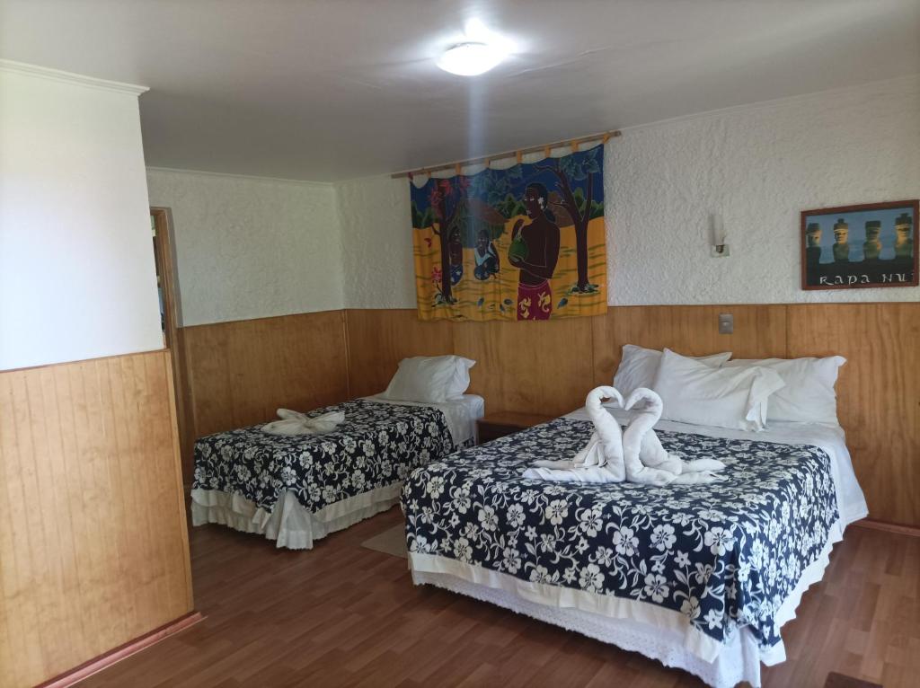 Letto o letti in una camera di Cabañas MANA NUI INN