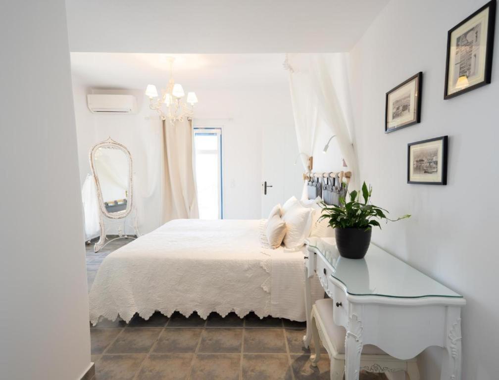 Postel nebo postele na pokoji v ubytování Kaiya Villas