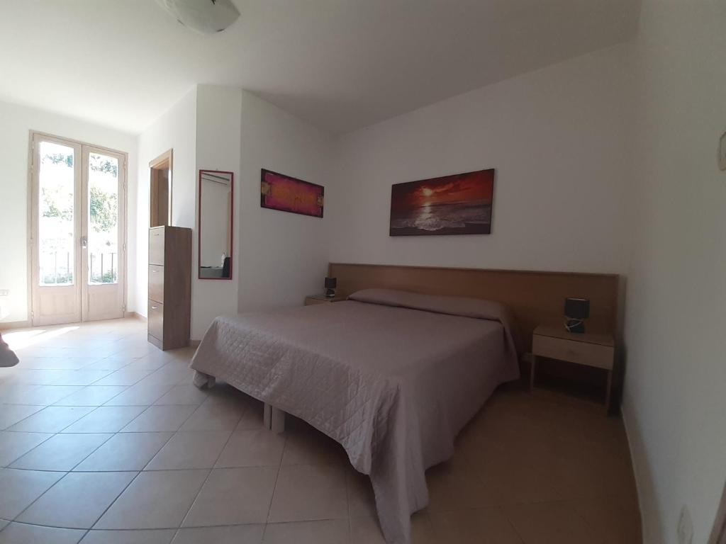 Postel nebo postele na pokoji v ubytování B&B Borgo Minerva