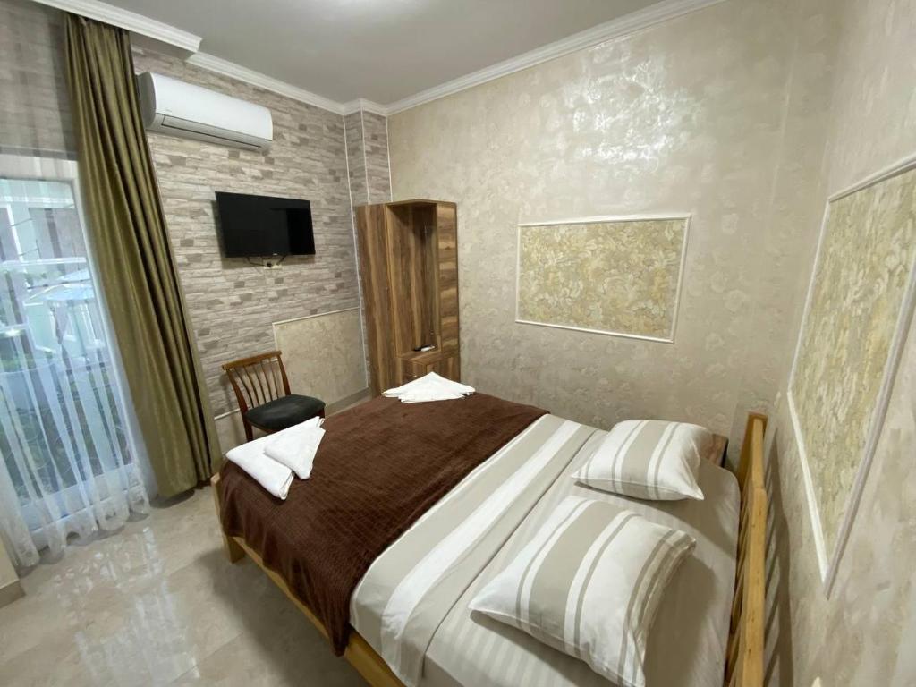 Llit o llits en una habitació de GUEST HOUSE OCEAN FORCE