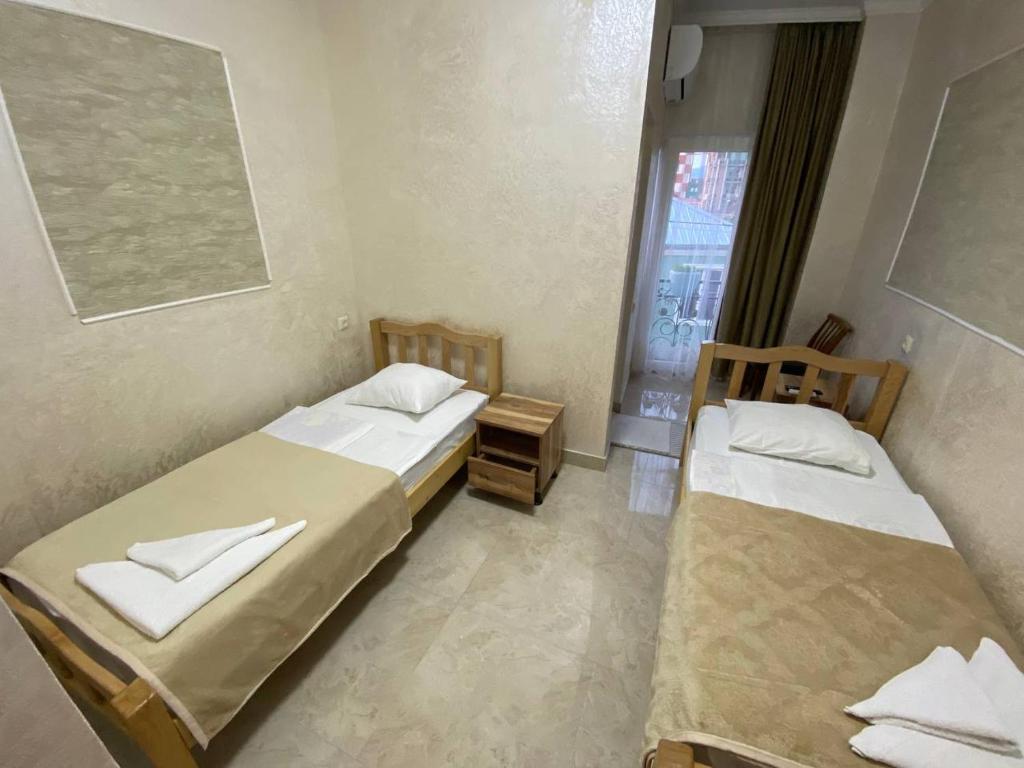 Llit o llits en una habitació de GUEST HOUSE OCEAN FORCE