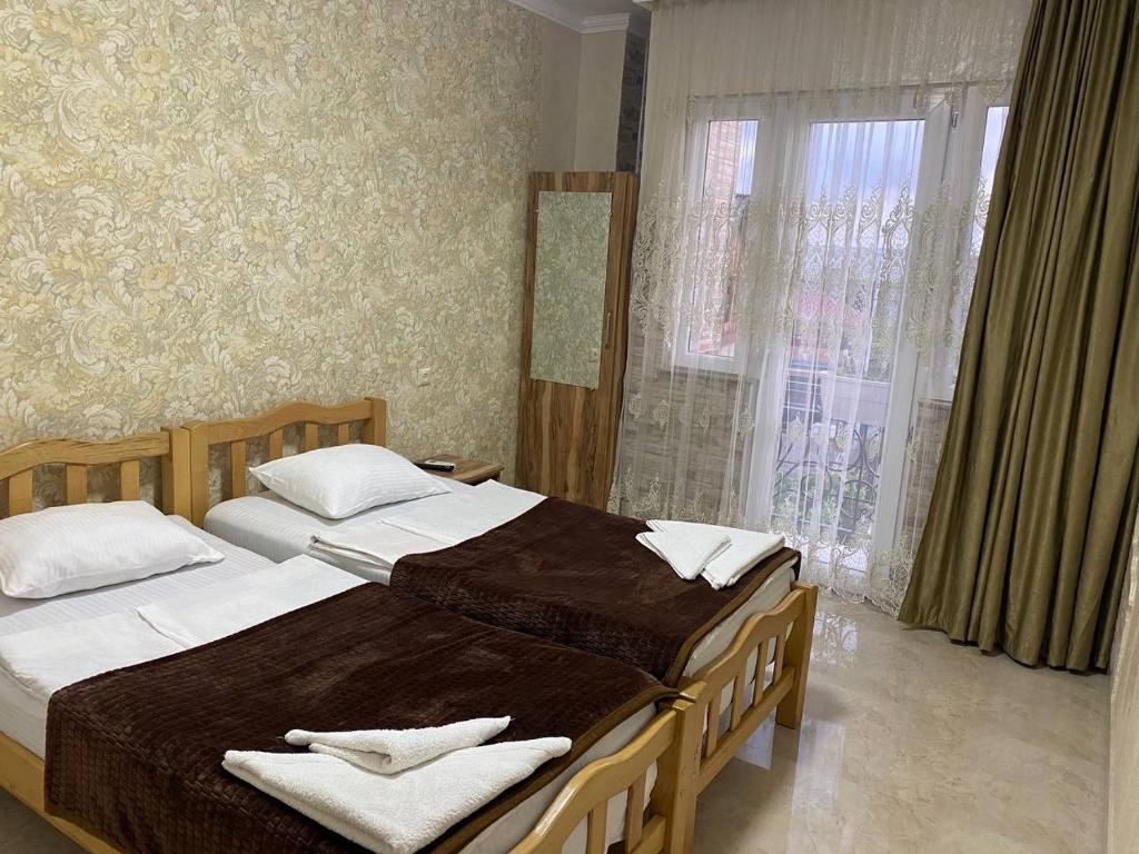 Llit o llits en una habitació de GUEST HOUSE OCEAN FORCE