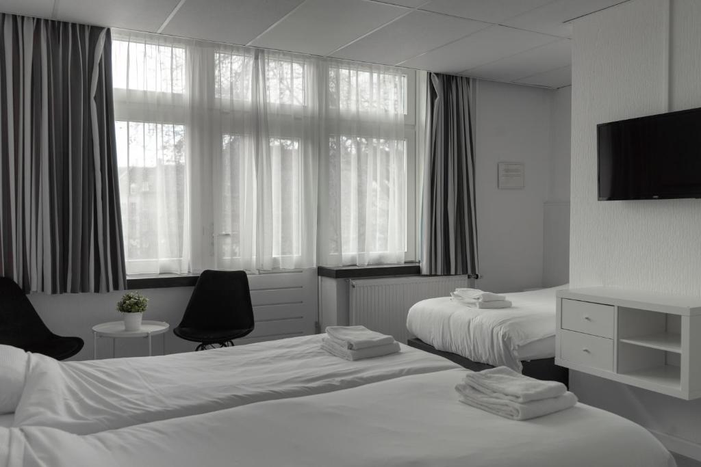 Postel nebo postele na pokoji v ubytování Hotel de la Bourse